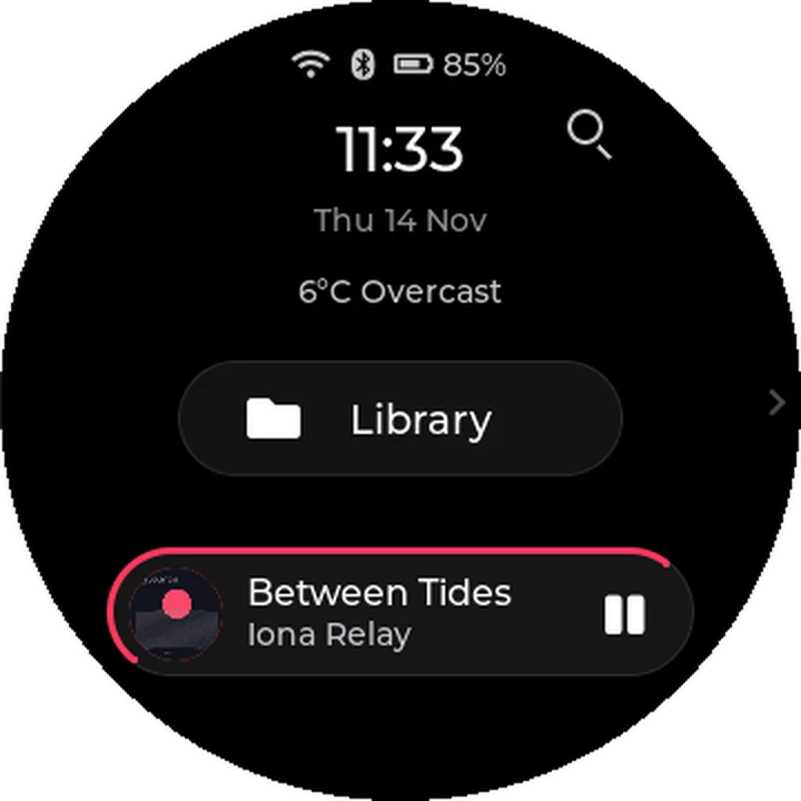 Home in halo: the time, date and weather above the current song, with progress around the now-playing island